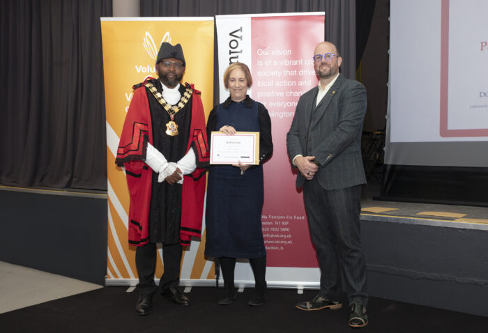 Barbara Ford receives her award, photographed with the Mayor